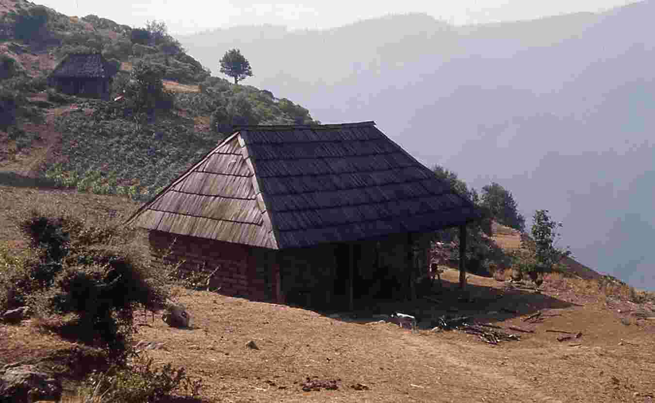 Figure 1.12. A typical house in Patalcal: walls of adobe, roof of wood shingles. The porch and patio in front of the house are the principal work areas. Photo by the author.